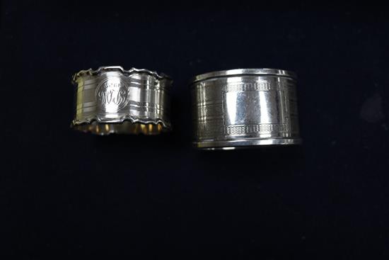 A cased set of six late Victorian silver napkin rings, Birmingham, 1897, a later pair and two other napkin rings.